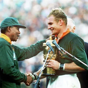 South Africa captain Francois Pienaar receives the World Cup from Nelson Mandela in 1995