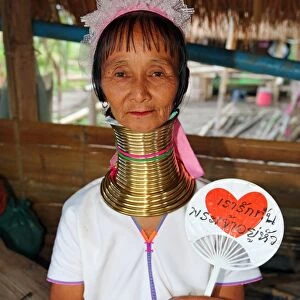 Giraffe women wearing brass rings on their necks in the Long Necked Karen village in Chiang Rai province in Thailand