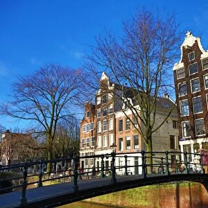 Traditional houses and a bridge over a canal on Brouwersgracht in Amsterdam, Holland