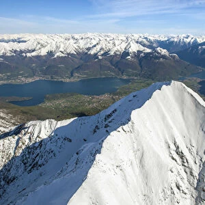 Aerial picture with Mount Legnone in close-up and Alto Lario that intersects Valtellina