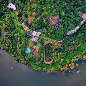 Aerial view of buildings along the coast with forest at Kandalama Reserve, Sri Lanka