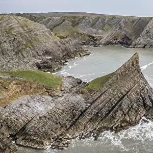 Aerial view of The Knave on the dramatic coastline of the Gower Peninsula, South Wales, UK. Spring (March) 2022