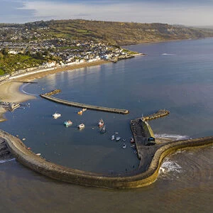 Aerial view of Lyme Regis and the Cobb harbour wall, Lyme Regis, Dorset, England. Winter (February) 2022