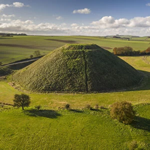 Aerial view of Silbury Hill, a prehistoric artificial mound in Wiltshire, England