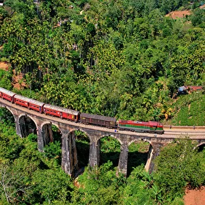 Aerial view of a train crossing the Nine Arch Bridge in Badulla, Sri Lanka