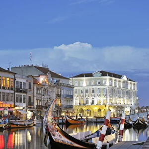 Aveiro at twilight and the traditional boat Moliceiro. Portugal