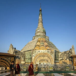 Buddhist monks walking by Werawsana Jade Pagoda (AKA Verochana Jade Pagoda
