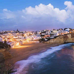 Carvoeiro, Lagoa, Algarve, Portugal. City lights at dusk
