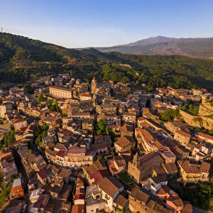 Castiglione di Sicilia, Sicily. Aerial view of the village with the Etna volcano in the