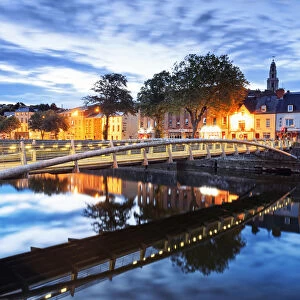 Europe, Ireland, Cork by night with colored houses reflecting on Lee river