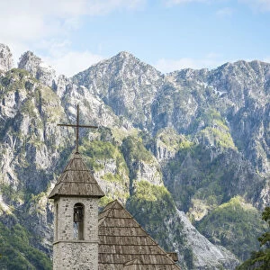 Exterior of Theth Village Church with The Accursed Mountains in background, Theth