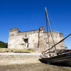 Gerezani an ancient fort with traditional dhow, Kilwa Kisiwani, coast of Tanzania