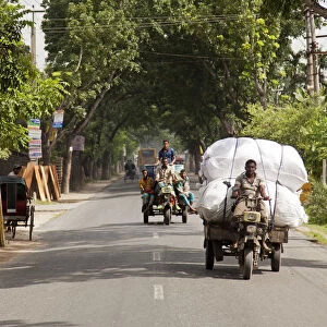Jessore, Bangladesh. The main route into Jessore is busy with crops being transported