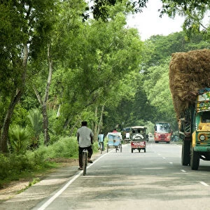 Khulna, Bangladesh. Loaded trucks bring crops from the countryside to the centre of