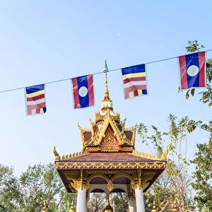 Laos, Vientiane. Small votive altar inside Wat Sisaket temple complex