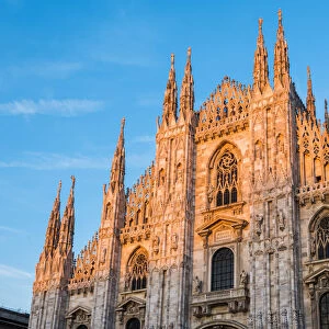 Milan, Lombardy, Italy. Facade of the Milans Cathedral at sunset