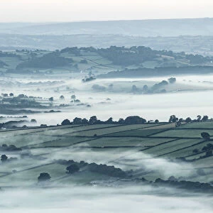 Mist over countryside at dawn near Brecon, Powys, Wales, UK