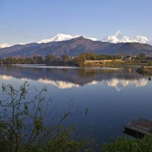 Nepal, Pokhara, Annapurna range reflecting in Phewa Lake