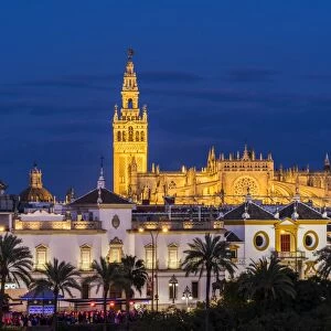 Night view of city skyline with Cathedral and Giralda bell tower, Seville, Andalusia