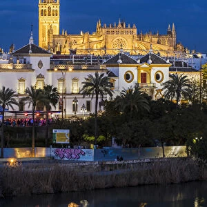 Night view of city skyline with Cathedral and Giralda bell tower, Seville, Andalusia
