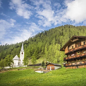 Old mountain farm and church in the village of Kalkstein, Innervillgraten, Villgratental, East Tyrol, Tyrol, Austria
