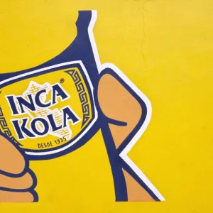 A painted sign for Inca Kola