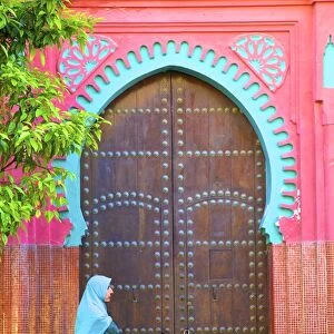 Person Walikng Infront Of Traditional Moroccan Decorative Door, Tangier, Morocco
