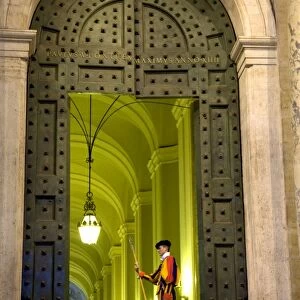 Rome, Italy; A Swiss guard at the entrance gates to the Vatican