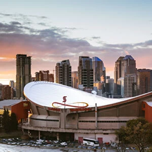 Saddledome stadium and city skyline at sunset, Calgary, Alberta, Canada