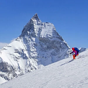 Skier and Matterhorn mountain in the background, Zermatt, Switzerland