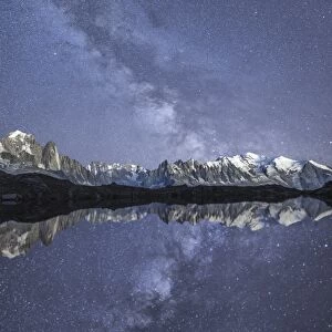 Starry sky over Mont Blanc range seen from Lac de Chesery. Haute Savoie. France Europe