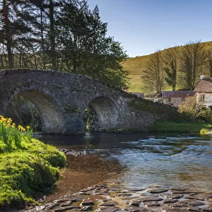 Stone bridge over Badgworthy Water in the picture postcard village of Malmsmead