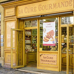 Storefront of La Cure Gourmande specialty biscuit shop on Place Richelme, Aix-en-Provence