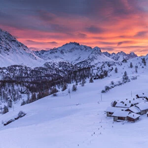 Sunset on the alpine village of Grevasalvas after a snowfall, Engadine