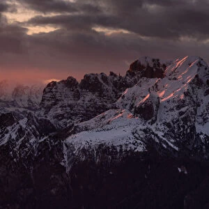 Sunset on the top of Dolada Mount, in Alpago mountain range, Italy