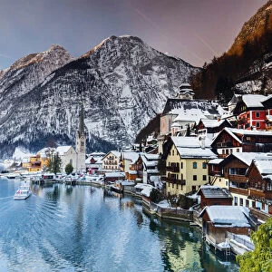 Typical village called Hallstatt con the Hallstatter see at sunrise with the houses