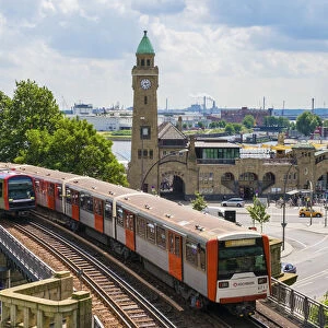 U-Bahn trains passing in front of St. Pauli LandungsbrAocken, St. Pauli, Hamburg, Germany