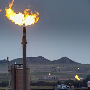 USA, North Dakota, Watford City, Oil Field, Yellow Flame Is Flaring And is Disposing