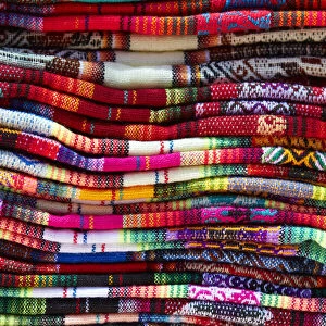 A detail of the vibrant colors of northern Argentinian textiles from a street stand of
