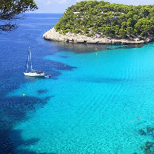 View of Cala Macarelleta and sailboat, Menorca; Balearic Islands; Spain; Europe