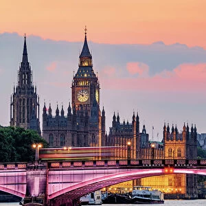 View over the River Thames towards the Palace of Westminster at dusk, London, England, United Kingdom