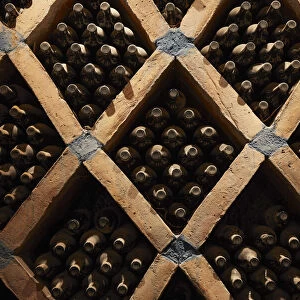 Vintage wine bottles in the cave of the Bodega "Las Arcas de Tolombon" winery, Colalao del Valle, Calchaqui Valleys, Tucuman, Argentina