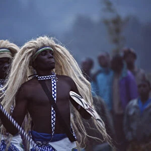 Virunga, Rwanda. Traditional Intore dancers perform at the foot of the Volcanoes National