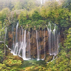Waterfall in deciduous forest in autumn - Croatia, Lika-Senj