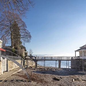 Waterfront promenade with bathing huts in Wasserburg am Bodensee, Bavaria, Germany