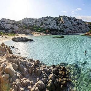 Woman bathing at Cala Napoletana at Caprera Island, La Maddalena Archipelago, Sardinia