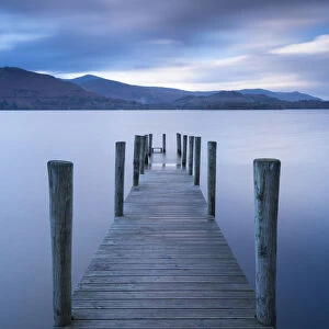 Wooden jetty on Derwent Water in the Lake District, Cumbria, England. Autumn (November)