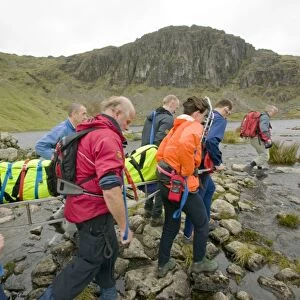 The Langdale Ambleside Mountain Rescue Team stretcher an injured hiker of the Langdale Fells in the Lake District