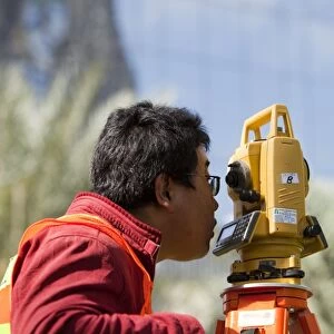A surveyor working on a construction project in Dubai