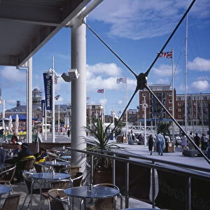 ENGLAND Hampshire Portsmouth Gunwharf Quay Shopping Centre Outside Cafe with view across
